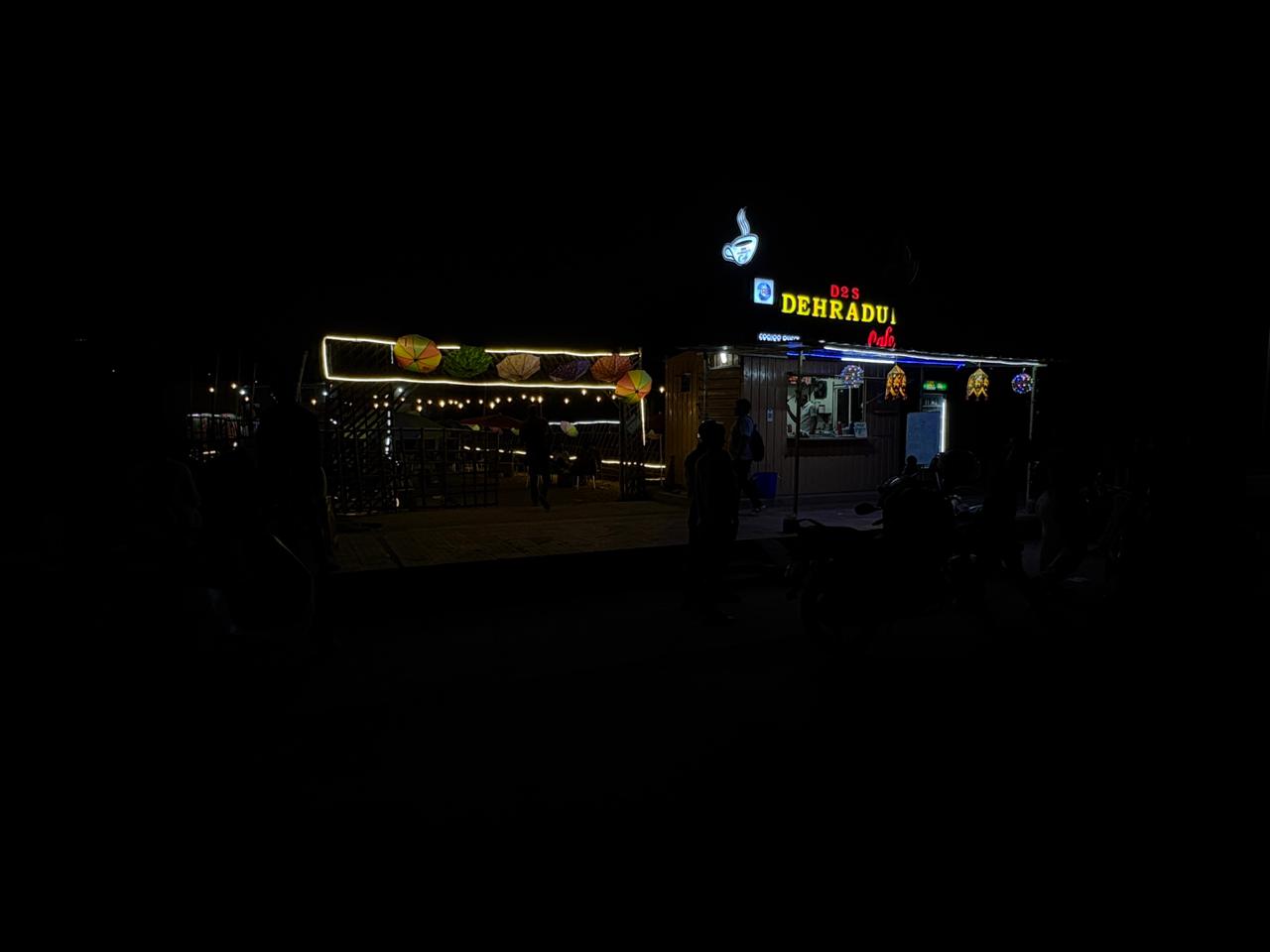 Night view of cafe with neon signage